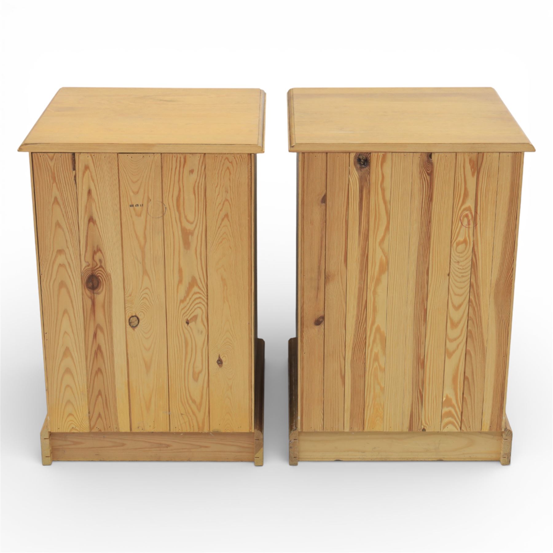 Pair of late 20th century waxed pine bedside chests, three drawers with moulded edges and turned pulls, raised on a plinth base 