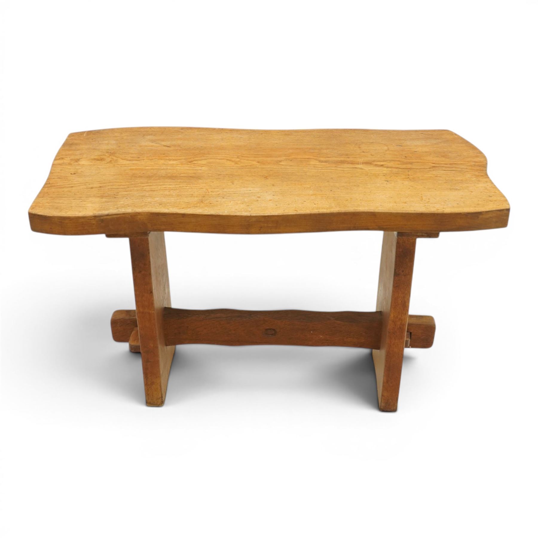 Acornman - rustic oak console table, shaped rectangular top, on shaped end supports, united by a stretcher with carved acorn signature, by the workshop of Alan Grainger, Brandsby