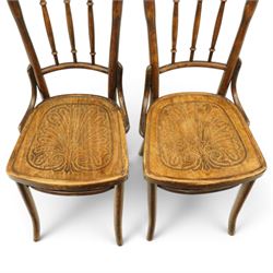 Thonet - pair of early 20th century bentwood bistro side chairs, spindle backs over anthemion motif seats, on tapering supports