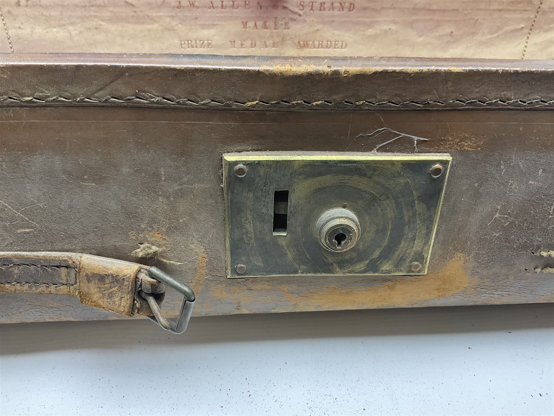 19th century leather suitcase, with brass plaque to cover engraved 'C R F Lutwidge Esq', the pink silk and white kid leather interior with pouch and edging impressed with gilt lettering reading 'By Appointment of Prince of Wales J W Allen 37 Strand Maker Prize Medal Awarded', H21cm, W73cm, Notes: Charles R. Fletcher Lutwidge, was mayor of Tunbridge Wells between 1895-1898, and again between 1901-1902