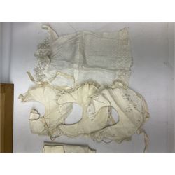 Late 18th century sampler worked with the alphabet above verses in red, by Mary Birkett aged 10 November 16th 1792, H33.5cm W34.5cm, together with another sampler worked with the alphabet above Proverbs 14:23, by Mary Anne Hainworth, Chesham, date unknown (--83), both in glazed frames, together with a quantity of Victorian and later dolls clothes to include lace examples