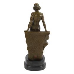 After Milo; Egyptian lady leaning on a wall with sphinx carving, upon a stepped oval base H25cm