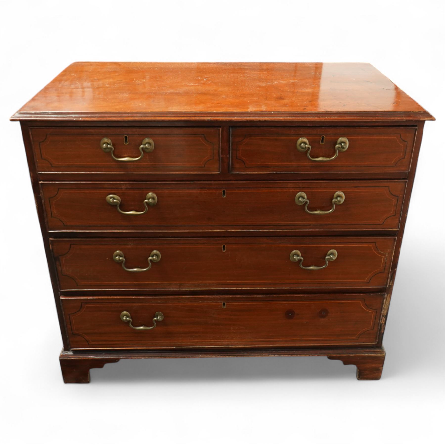 19th century mahogany chest, rectangular moulded top over two short and three long graduated drawers, each with satinwood stringing and shaped ebony inlaid panels, fitted with brass swan neck handles, raised on bracket feet