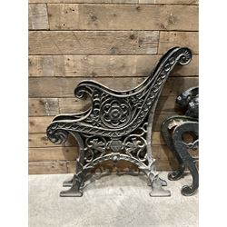 Four pairs of ornate cast iron bench ends (8)