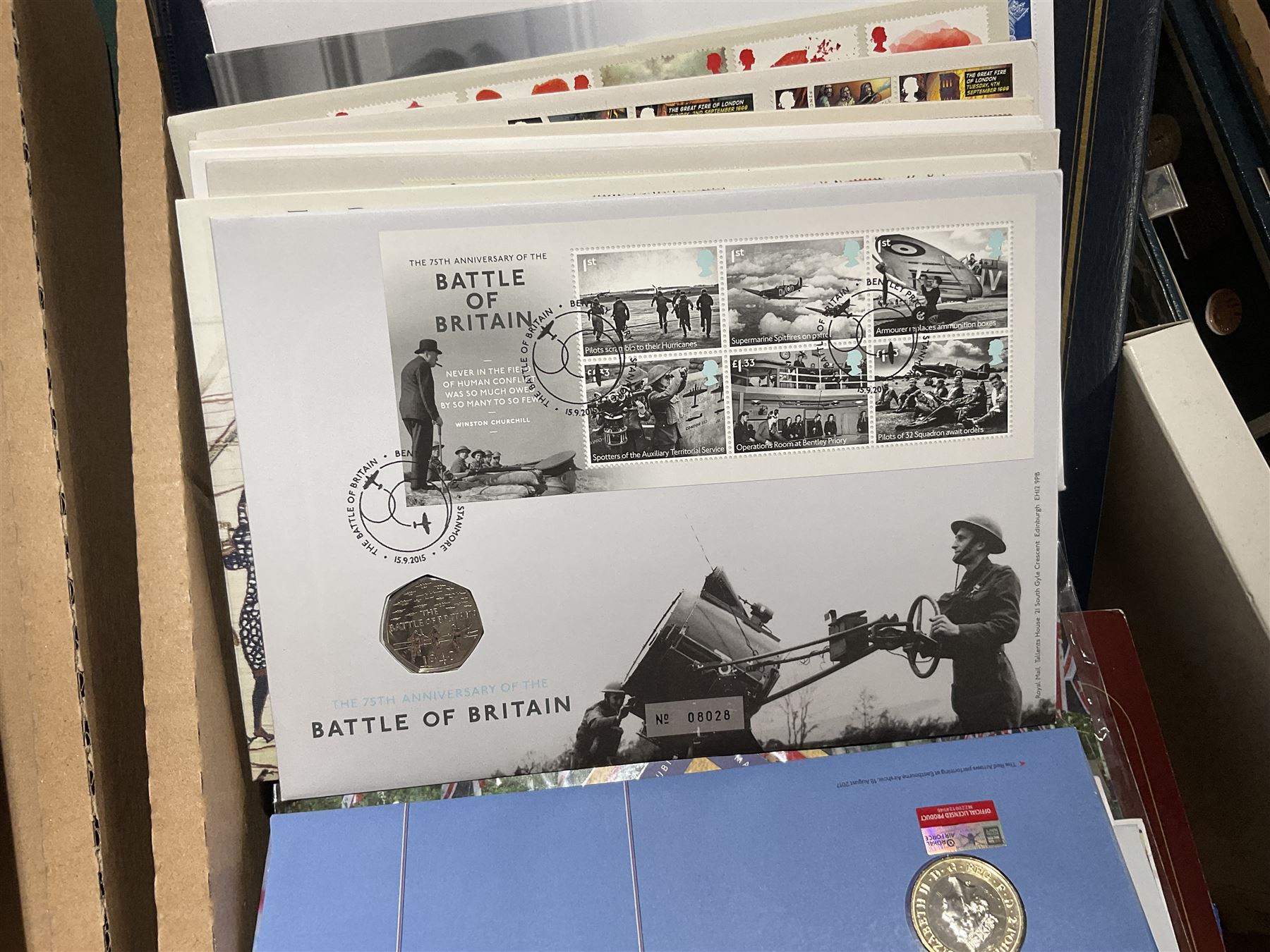 Approximately one hundred and fifteen Royal Mint coin covers, in two ring binder folders and loose, together with approximately 53 grams of Great British pre-1920 and approximately 68 grams of Great British pre-1947 silver threepence coins, and a small quantity of further pre-decimal coins