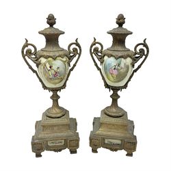 Pair gilt metal and porcelain urn clock garnitures, the urns with acorn finials and panels of figures in a landscape, H39cm