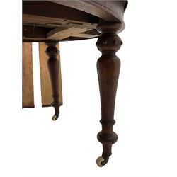 Victorian mahogany oval extending dining table, moulded edge and banded frieze, turned supports on ceramic castors with two additional leaves and winder