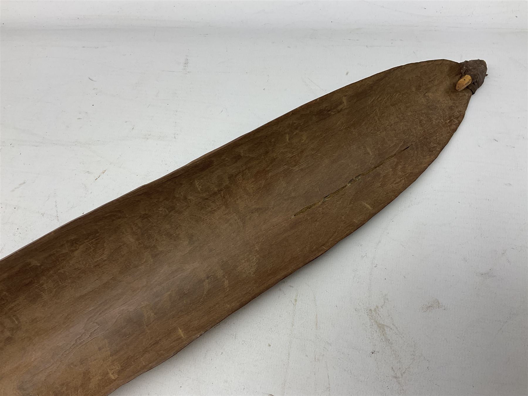 Australian Aboriginal shield, carved with Kangaroo and Emu, 74.5cm; Spear painted with aquatic creatures 78cm, and Spear thrower 81cm (3)