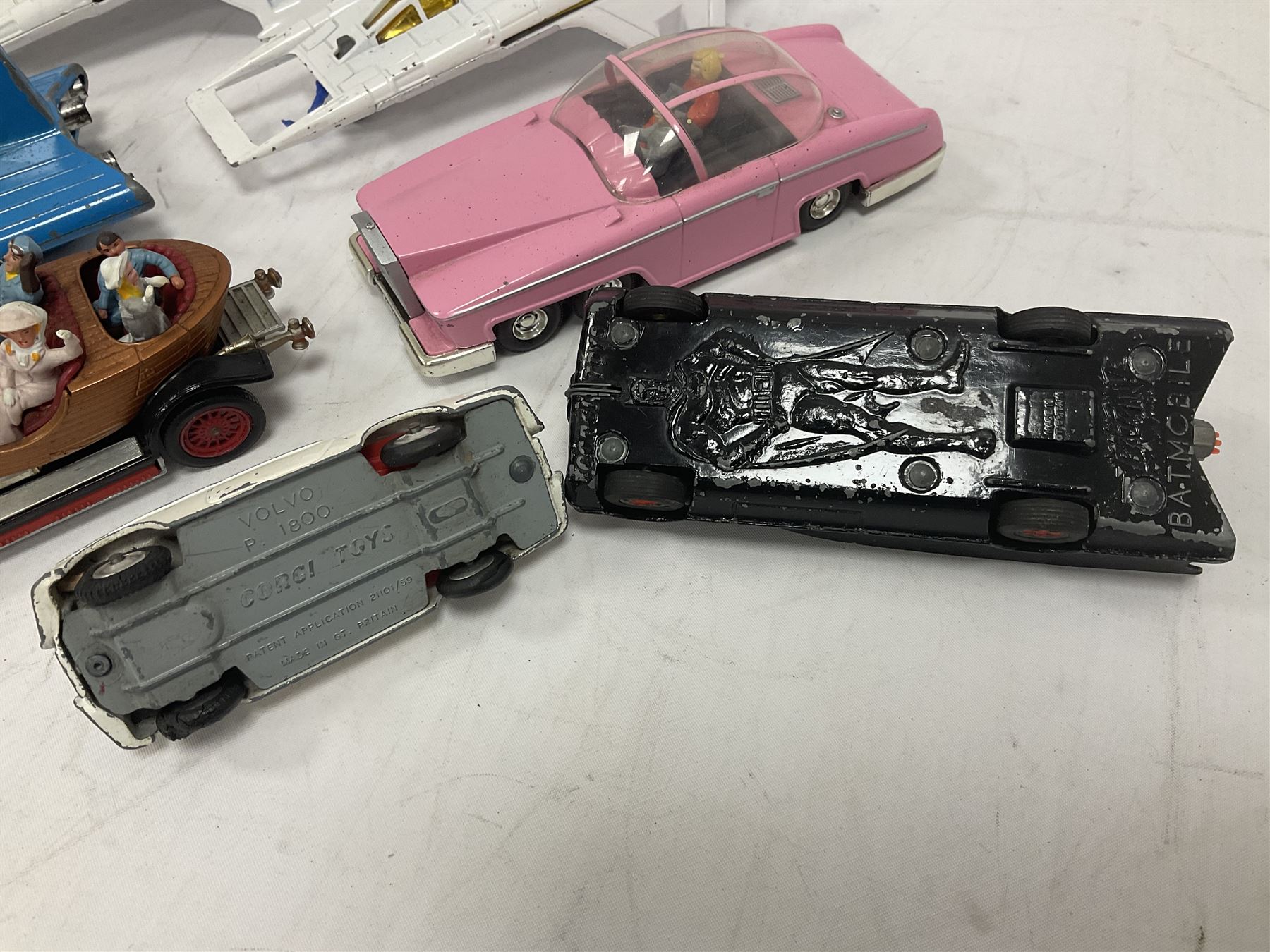 Corgi - seven unboxed and playworn TV/Film related die-cast models including Chitty Chitty Bang Bang with all four figures, Batmobile with both figures, Lady Penelope's FAB 1 with both figures, Superman Supermobile, two Buck Rogers Starfighters and The Saint's Volvo P.1800 (7)