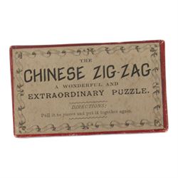 Early 20th century and later puzzles and games, including Bikee, 'A Novel and Very Amusing Game', by C.W. Faulkner & Co, Multum-In-Parvo Puzzle by RJ London, The Original 15 Puzzle by RJ London, The Chinese Zig-Zag 'A Wonderful and Extraordinary Puzzle', The Subway Puzzle by R Journet London, etc, all in glazed wooden display case