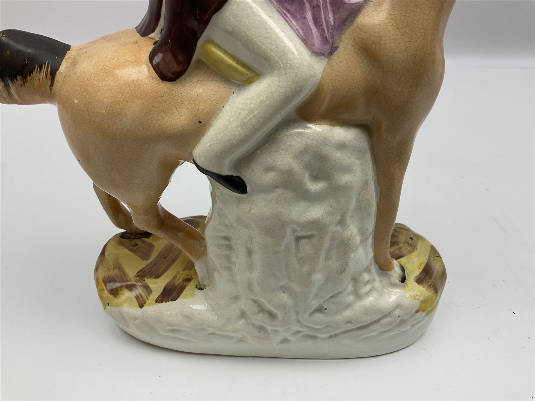 19th century Staffordshire figure of Robert Peel, titled 'Sir Robert Peel', modelled on horseback, atop an oval plinth base featuring a naturalistic and floral design, H30cm 