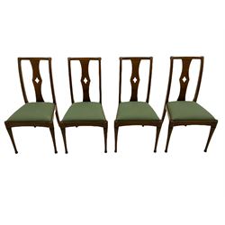 Set of eight contemporary walnut dining chairs, curved backs set with shaped splats with pierced detail, drop in upholstered seat cushions, on turned supports 