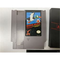 Nintendo Entertainment System (1985) console with two controllers, accessories and instruction booklet. NES Games ‘Duck Hunt’ with Nintendo Zapper gun, ‘Pinball’ and ‘Super Mario Bros.’, all with original sleeves and instruction booklets. NES game ‘Super Mario Bros. 2’ cartridge only