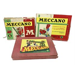 Meccano - Outfits 4, 6 & 7 with red and green parts; Outfits 4 & 6 virtually fully stocked and Outfit 7 containing large quantity of loose parts; Outfits 4 & 7 with instruction manuals; all boxed (3)