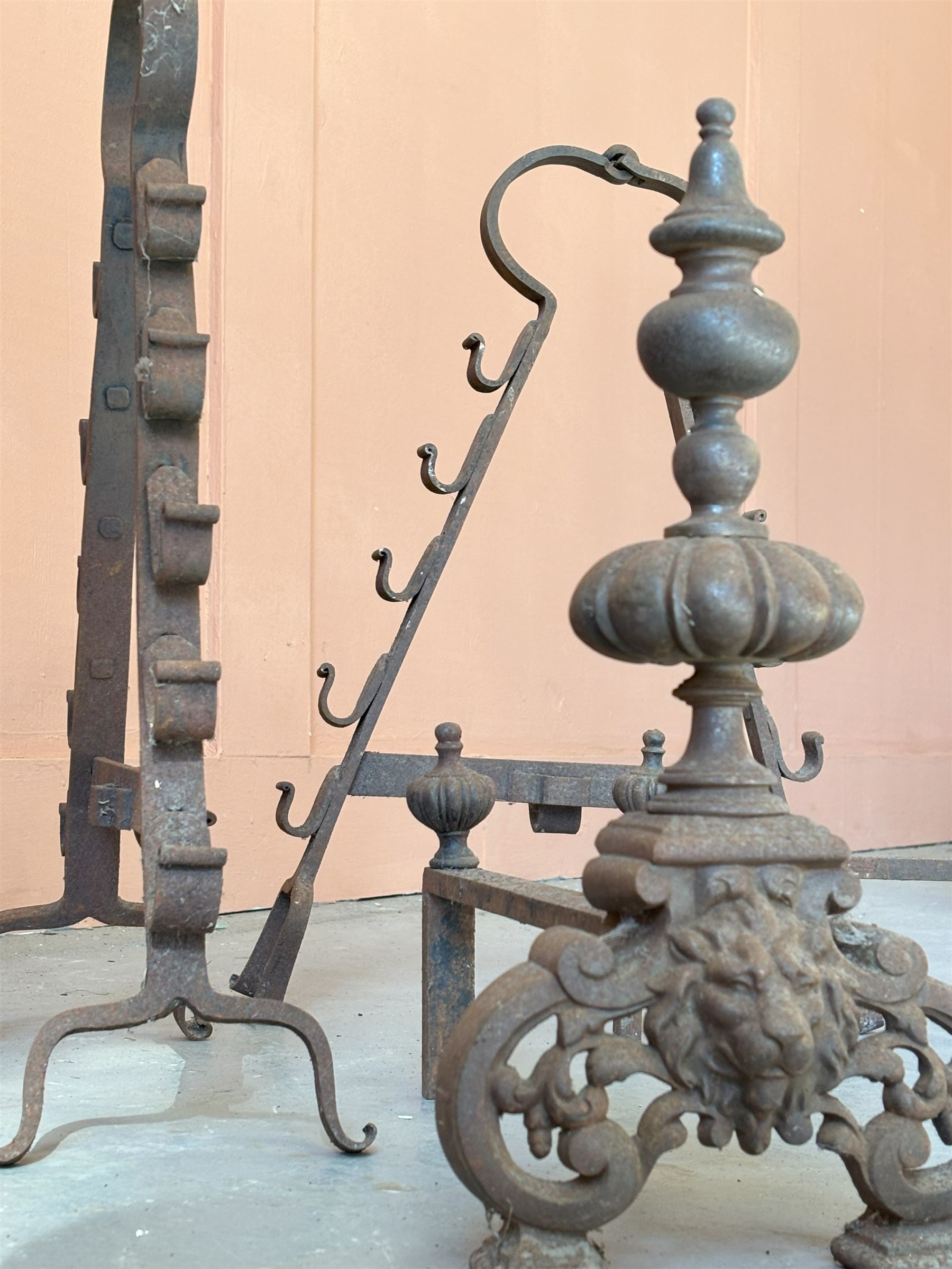 Pair of Dutch cast iron fire dogs with lion mask motif (H42cm) together with a 19th century wrought iron spit rack (H60cm)  - COLLECTION BY APPOINTMENT FROM: The White House, Thirsk Road, Easingwold, York, YO61 3NF - CALL 01723 507111 TO ARRANGE