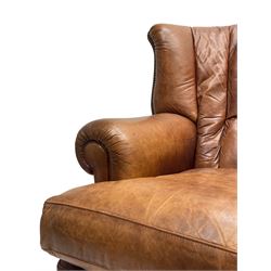 Tetrad - 'Blake' club armchair, fanned wingback and rolled arms upholstered in tan brown leather, on ball and claw carved cabriole feet 