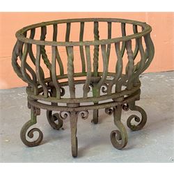 Wrought iron dog grate of oval outline, raised on six scrolled supports. H42cm, W52cm, D41cm.  - COLLECTION BY APPOINTMENT FROM: The White House, Thirsk Road, Easingwold, York, YO61 3NF - CALL 01723 507111 TO ARRANGE