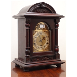  Edwardian stained carved arched top bracket clock with brass Arabic dial and bevelled glass door with columns, triple train movement Westminster chiming on rods, with side chime lever on ball feet, H47cm   