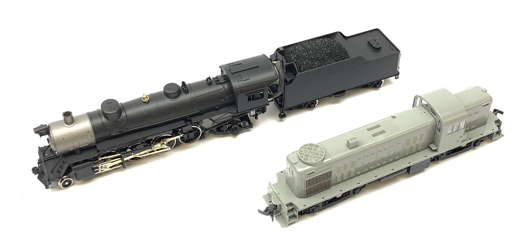 HO scale - Athearn Genesis G9010 USRA 2-8-2 locomotive; and Kato Alco RS2 37-2100 locomotive with unopened sprue parts for completion, both undecorated mint and boxed with paperwork (2)