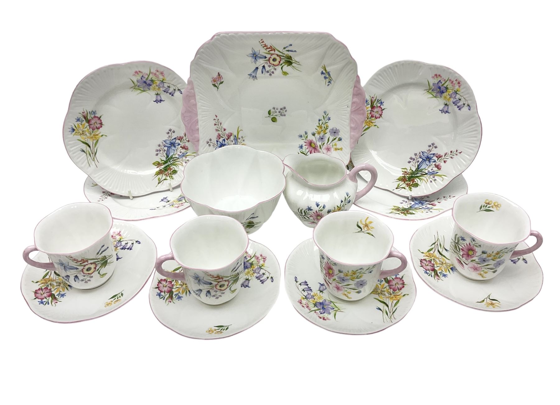Shelley Wild Flowers pattern part tea service, comprising four cups and saucers, four dessert plates, cake plate, milk jug and open sucrier