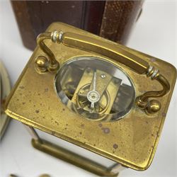 Late 19th century brass carriage timepiece clock, Arabic enamel chapter ring, single train driven movement, with leather case (H12cm), and a mid to late 20th century 'Kundo' anniversary clock under glass dome (H23cm)