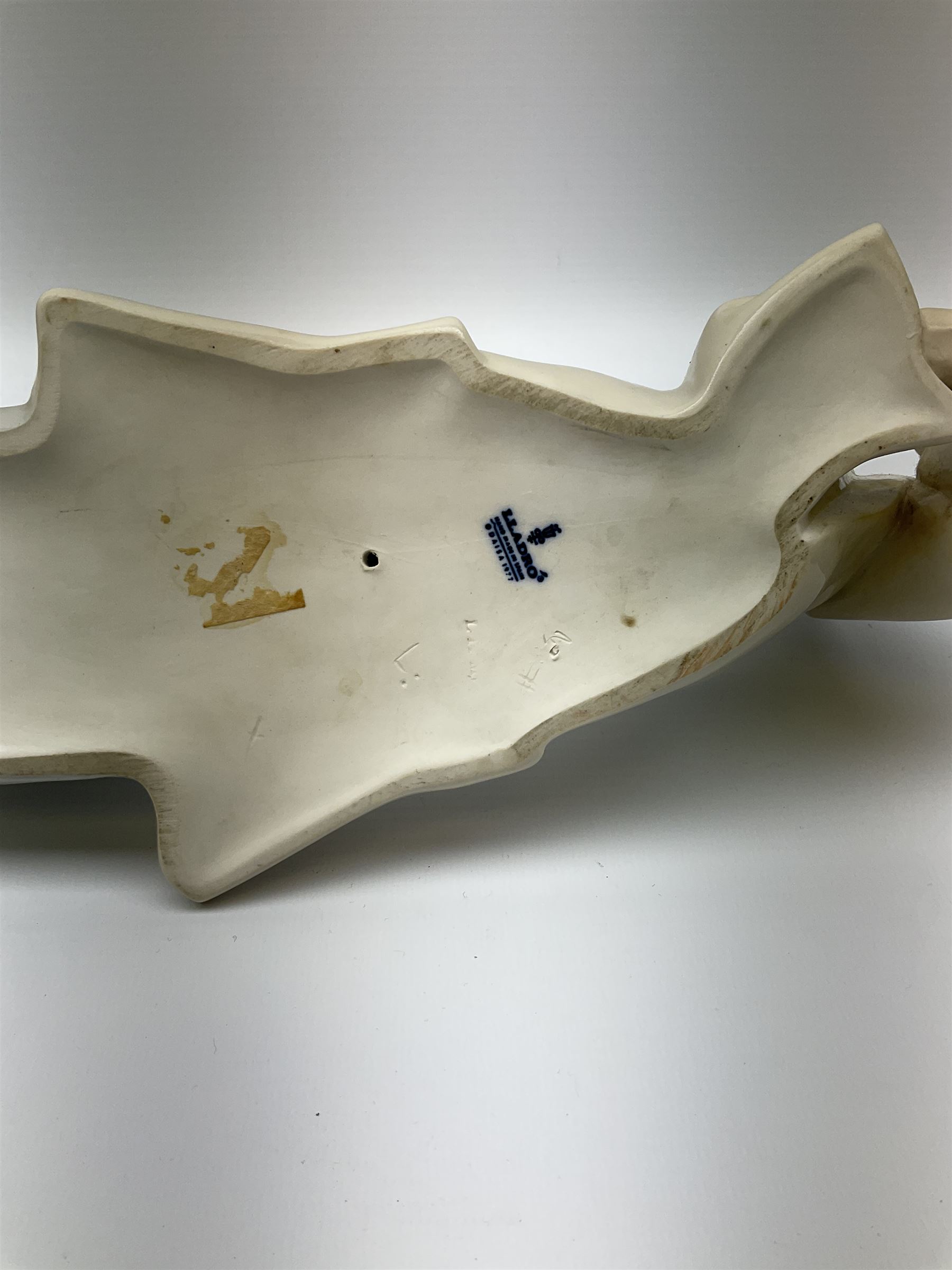 Collection of seven Lladro figures, including Seated ballerina with swan 6204, Childhood Dream 8129, Dancer 5050, reclining clown with ball alongside a selection of other figures. 