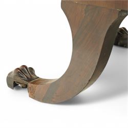 Regency brass inlaid rosewood chaise lounge or settee, shaped back over rolled head and foot, upholstered in black and gold striped fabric with rectangular squab cushion and bolster cushion, the rolled terminals carved with acanthus leaf roundels, lower rectangular foliate carved panels, on out splayed supports with paw carved feet 