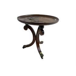 19th century occasional table, removable mahogany tray top carved and painted with tree and flower decoration, tripod rosewood base inlaid with mahogany and crossbanded, the supports scrolled with gilt chamfered edges and splayed, terminating in brass paw feet on castors