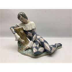 Lladro figure, Harlequin Reclining, modelled as a recumbent harlequin, no 5128, Sculpted by Salvador Furio, year issued 1982, year retired 1987, H28cm 