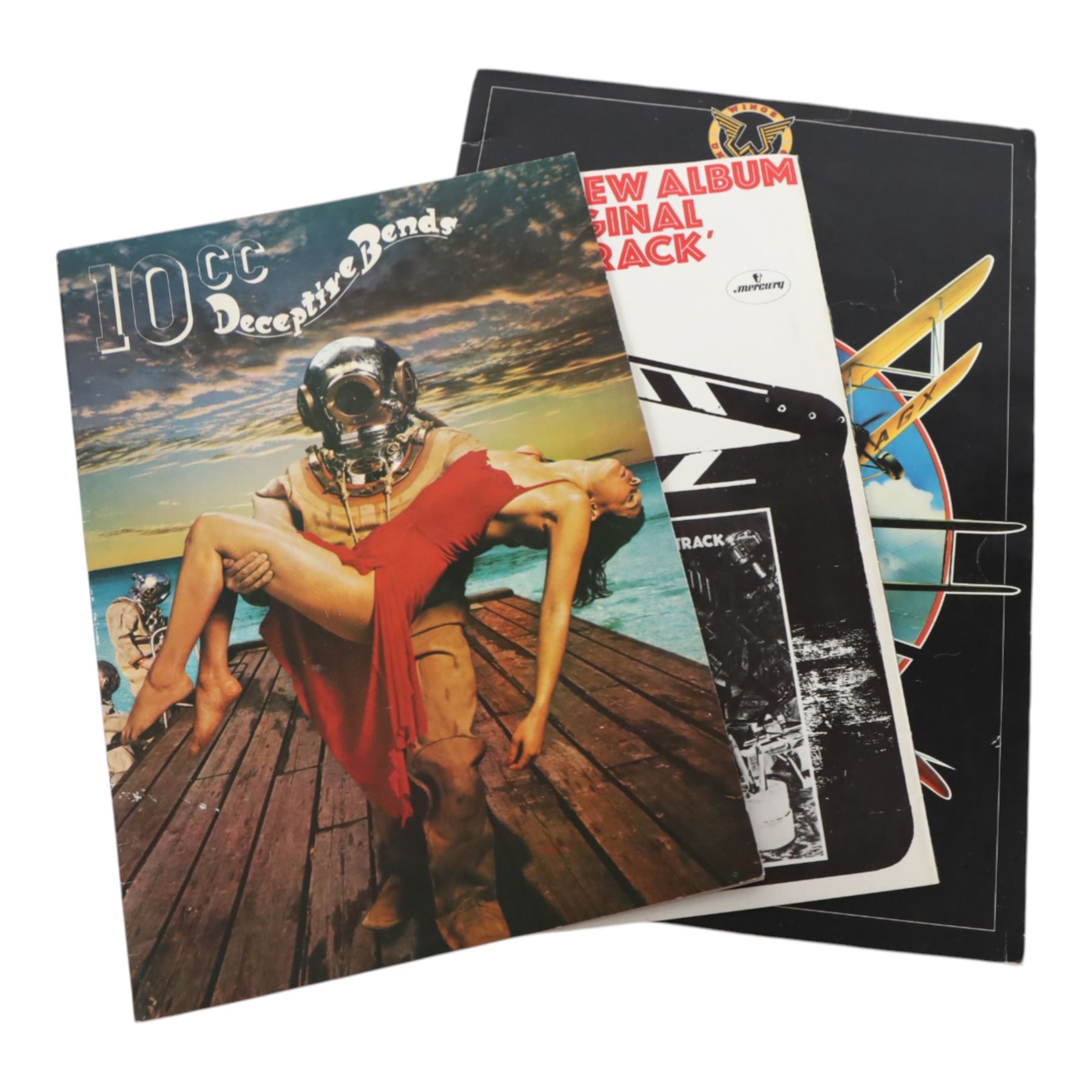 Music memorabilia, including cardboard globe, a free gift with the Wings Over America vinyl, music programmes, including Concert for George, Paul McCartney World Tour, Wings programmes, Glastonbury 1986, 10CC programmes, Knebworth Fair 1976 programme, etc