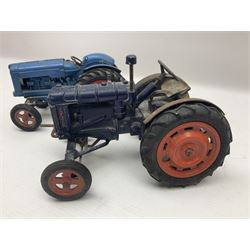 Chad Valley - two unboxed and playworn large scale Fordson tractors - No.9235 Fordson Major Tractor, dark blue diecast body, orange wheels, crank handle clockwork mechanism and 'Firestone' rubber tyres; and No.M59 New Fordson Major Tractor, blue diecast body, tinplate hinged bonnet, orange wheels and clockwork motor contained in rear wheel hub (2)