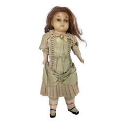 Victorian wax shoulder head doll with applied hair, inset glass eyes and jointed body with composition lower limbs; faded pink dress H35cm