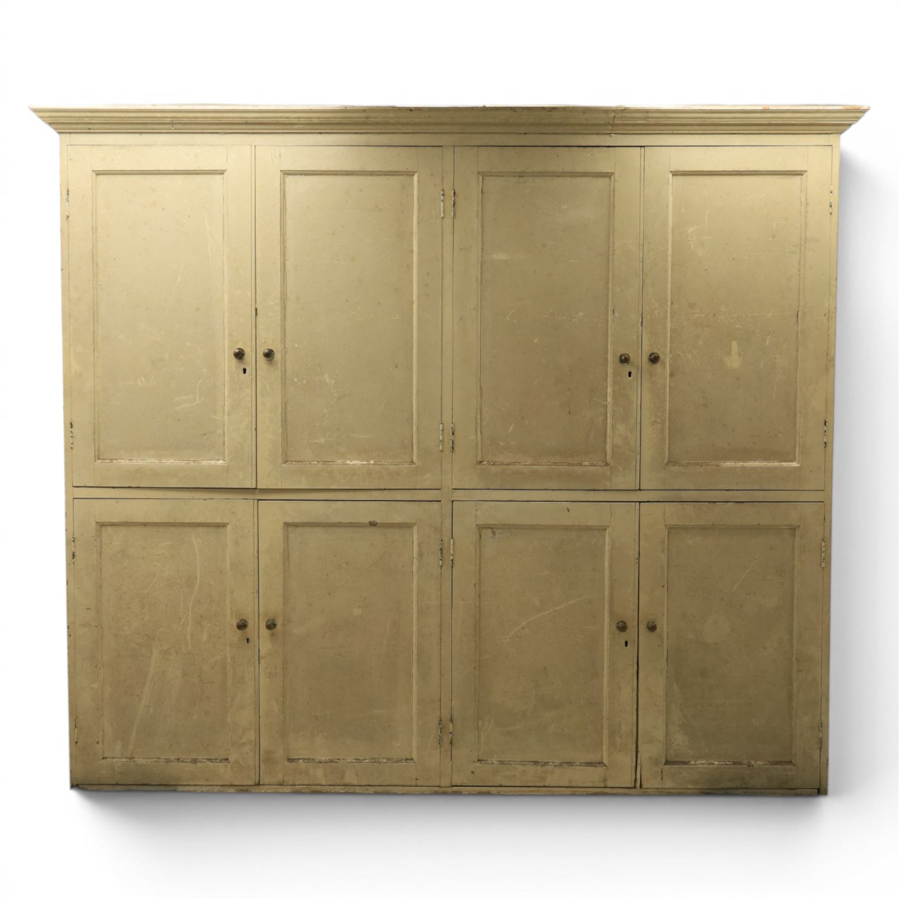 Large Georgian painted pine housekeepers cupboard, projecting cornice with four sets of twin cupboard doors with shelving enclosed