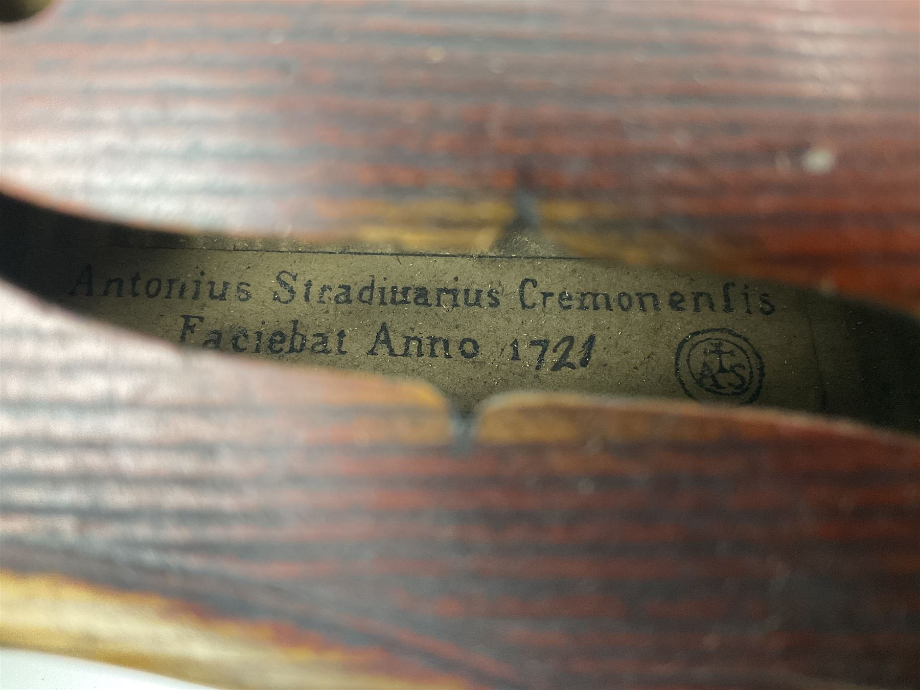 Late 19th century French three-quarter size 'Conservatory' violin with 34cm two-piece maple back and ribs and spruce top, the peg box inscribed 'Conservatory Violin Straduari', bears label 'Antonius Stradiuarius Cremonensis Faciebat Anno 1721' L55.5cm overall; in ebonised wooden 'coffin' case; and Saxony violin c1900 with 36cm two-piece maple back and ribs and spruce top; bears label 'Antonius Stradivarius Cremonensis Faciebat Anno 17**' L59cm overall; in carrying case (2)