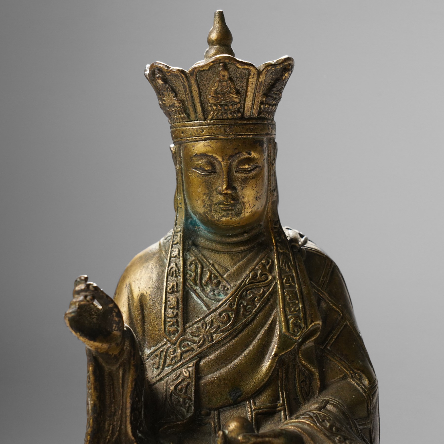 Chinese cast bronze figure of Ksitigarbha, wearing a five-pointed crown and monastic robes, H19.5cm