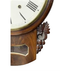 Late 19th century 8-day  drop dial wall clock in a mahogany case, carved ear pieces and glazed pendulum viewing glass, 12” painted dial with Roman numerals and Maltese steel hands, twin train going barrel movement striking the hours on a bell. No pendulum or key.