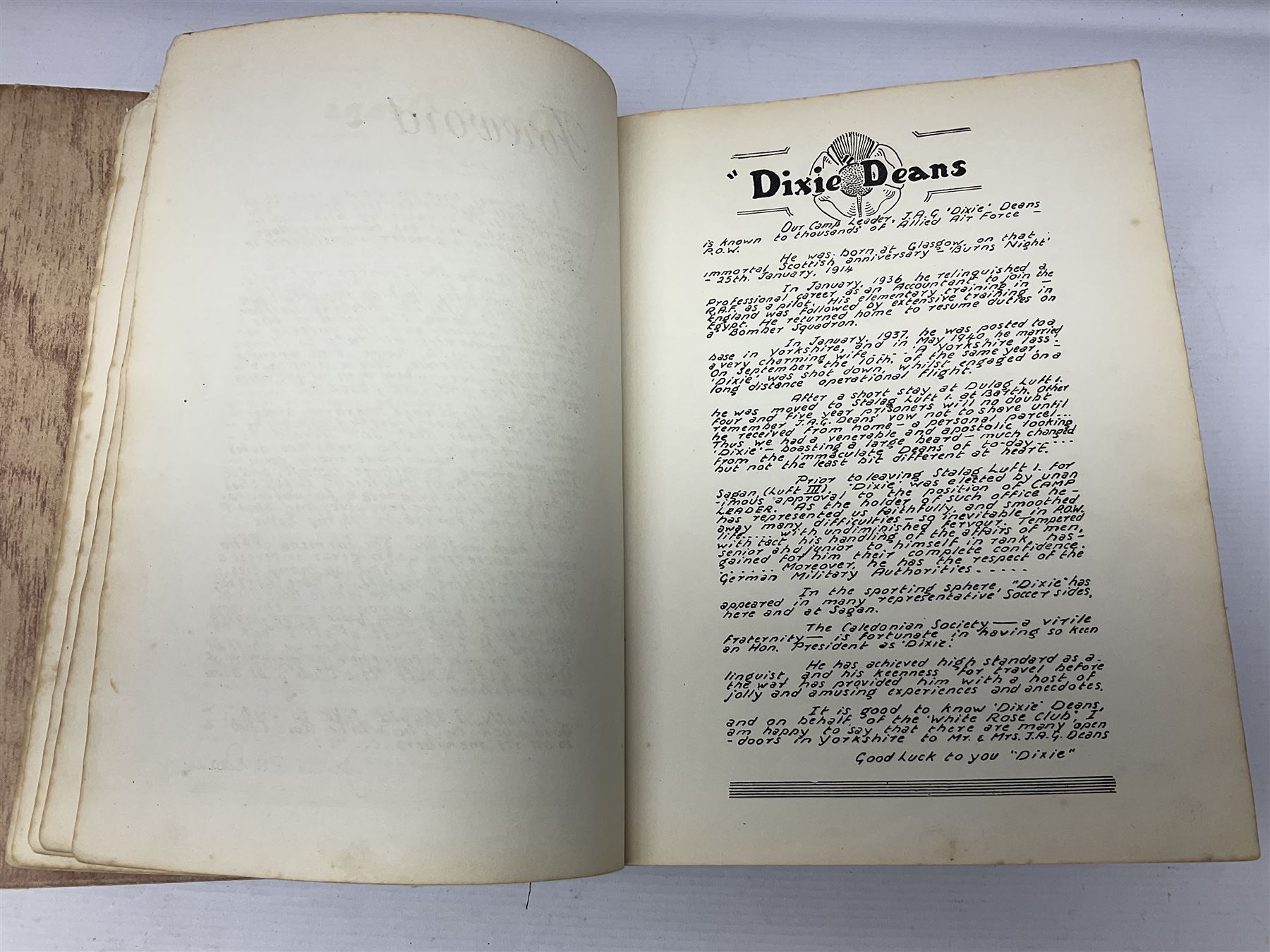 The Yorkshire Post Kriegie Edition. A 1945 book reproducing the exploits of Prisoners of War in Stalag Luft VI, with compliments letter from the publishers. Simulated wood paper covered card boards.