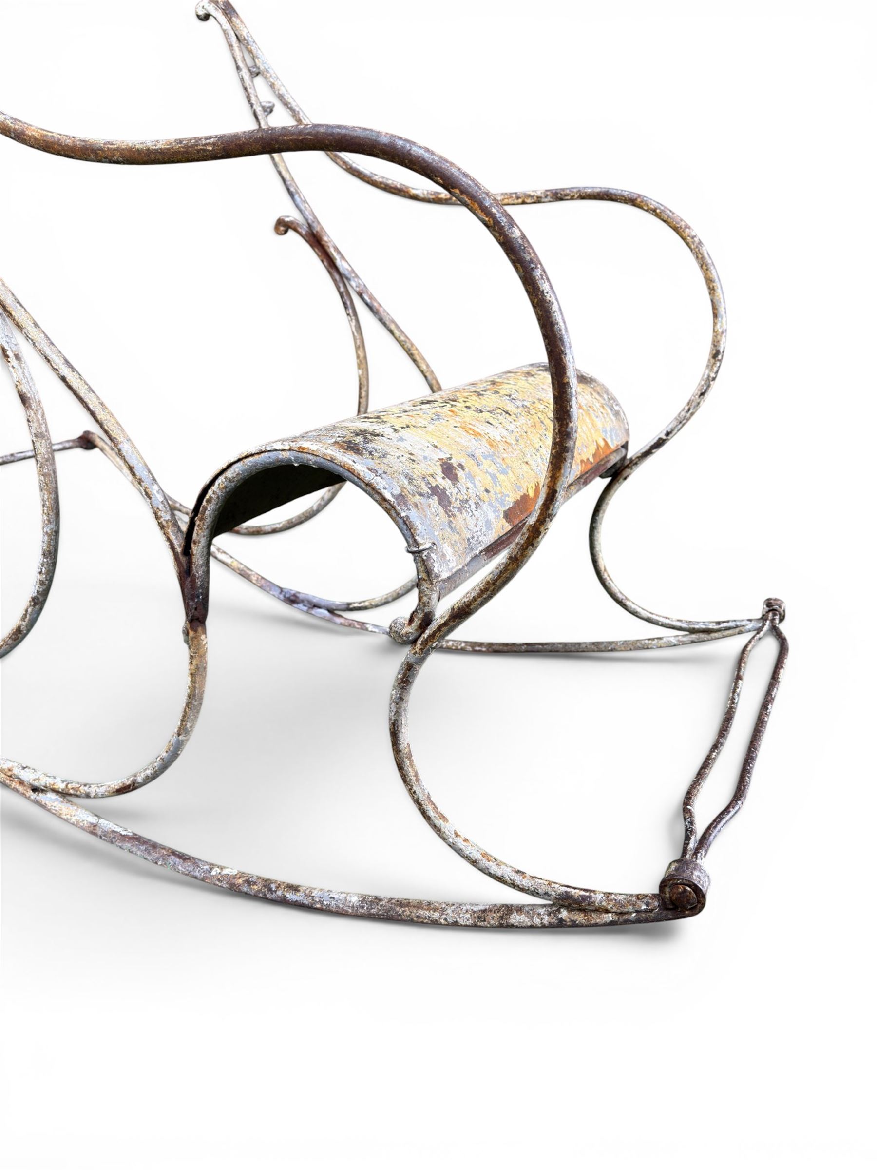 Pair of white painted cast metal garden chairs, ornate reclined backs, circular pierced seats on cabriole legs