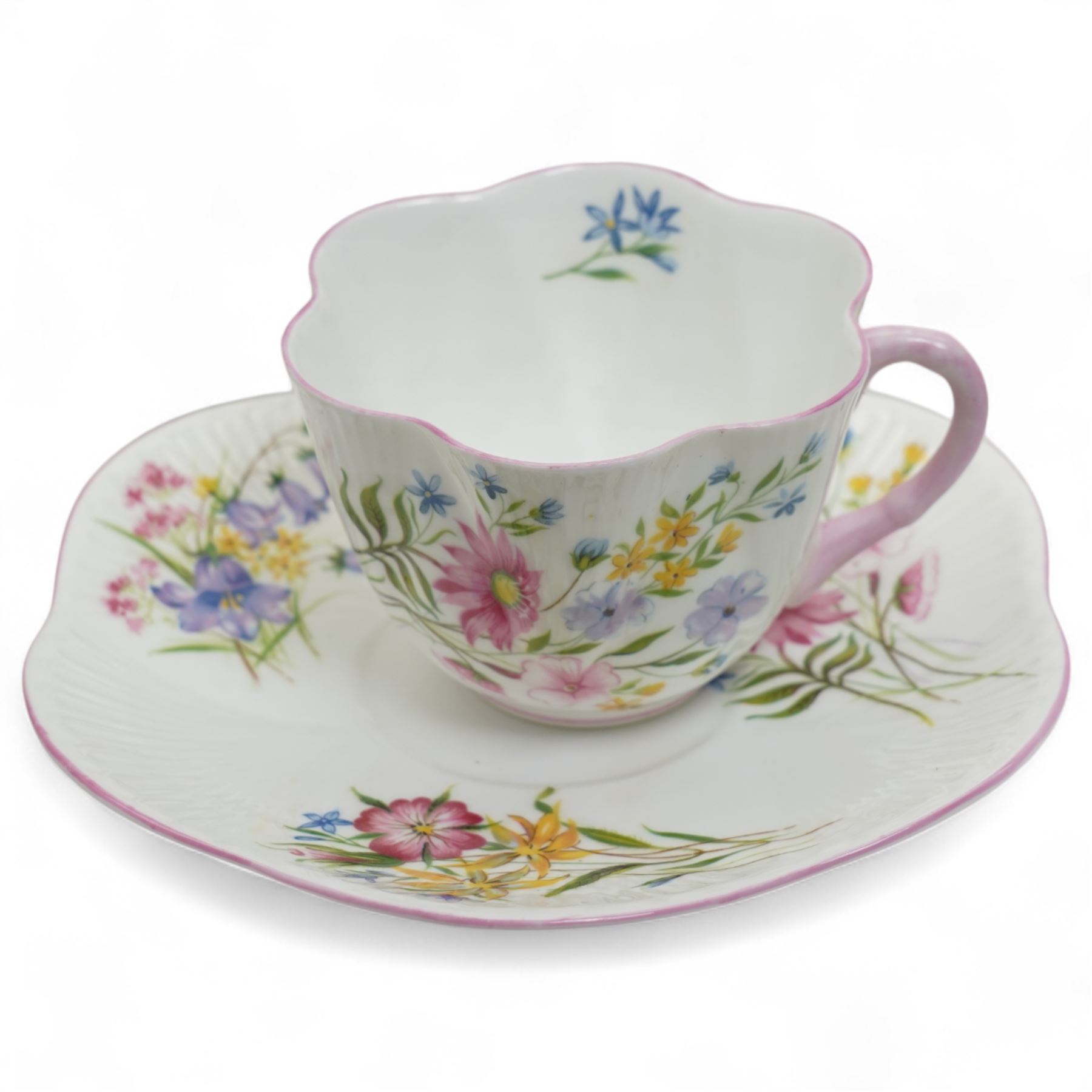Shelley 'Wild Flowers' pattern part tea service, comprising four coffee cups, five coffee cup saucers, nine teacups, eight teacup saucers, coffee pot, three milk and cream jugs, two bowls, five cake plates etc
