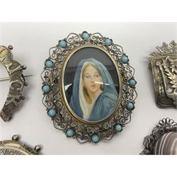 Six Victorian and later silver brooches, including Welsh dragon, horseshoe, religious portrait, coin and heart