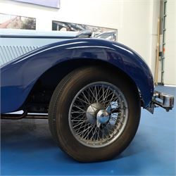 1939 MG SA Saloon

Registration: GRB 988
Chassis number: SA2983
Engine number: QPHG3242 (original engine)
Engine: 2,322cc six-cylinder petrol
Transmission: Manual
Odometer reading: 71,873 miles
Seating: Five
Colour: Two-tone blue
Former keepers: 6/7 recorded
V5C: Present
Keys: One

A 1939 MG SA Saloon, finished in an attractive two-tone blue colour scheme and retaining its original UK registration, GRB 988.

Introduced in 1936, the MG SA was the marque's prestigious sporting saloon, combining elegant coachwork with refined six-cylinder performance and luxurious accommodation. This example retains its original 2,322cc engine, numbered QPHG3242, and displays 71,873 miles on the odometer, although this mileage has not been independently verified.

The car is understood to have undergone an extensive rebuild and restoration between 2010 and 2015 and is today presented in showroom condition throughout. The coachwork has an excellent finish, complemented by outstanding chrome brightwork, wire wheels, a rear-mounted spare wheel, folding rear luggage rack and a desirable folding canvas sunroof. The engine bay is immaculately detailed, while the underside, chassis and suspension all reflect the high standard of restoration undertaken. A stainless-steel exhaust system has also been fitted.

The luxurious cabin features beautifully finished inlaid wood veneer, leather seating and period instrumentation, all presenting to an exceptionally high standard.

A particularly appealing aspect of this MG SA is its documented participation in the 1952 Daily Express National Motor Rally. Accompanying the vehicle are the original official rally programme together with period photographs showing the car competing in the event displaying entrant number 36. The programme lists entrant No. 36 in Class D.2 as an MG 2322cc, providing excellent documented provenance linking this car to one of Britain's best-known post-war motoring events, held between 12th and 15th November 1952.

Combining documented provenance with exceptional cosmetic presentation, this MG SA represents a rare opportunity to acquire one of MG's flagship pre-war sporting saloons.

At the time of cataloguing the vehicle started and ran well.

Features

• Original 2,322cc six-cylinder engine
• Manual transmission
• Original UK registration
• Two-tone blue coachwork
• Folding canvas sunroof
• Leather interior
• Inlaid wood veneer dashboard and trim
• Wire wheels
• Rear-mounted spare wheel
• Folding rear luggage rack
• Twin carburettors
• Stainless-steel exhaust system
• Extensive rebuild and restoration completed between 2010 and 2015

History and Documentation

• Approximately six to seven former keepers recorded
• Original engine (No. QPHG3242)
• Chassis No. SA2983
• Original UK registration
• Extensive rebuild and restoration completed between 2010 and 2015
• Original 1952 Daily Express National Motor Rally programme
• Period photographs showing the vehicle competing as Entrant No. 36
• V5C registration document not present
• One key

Condition

Presented in exceptional showroom condition, this MG SA has clearly benefited from a high-quality restoration completed to an impressive standard. The paintwork, chrome, interior, engine compartment and underside are all exceptionally well presented, reflecting the considerable work undertaken.

The vehicle started and ran well at the time of cataloguing. It has not been subjected to a full mechanical inspection by the auctioneers, and prospective purchasers should satisfy themselves as to the vehicle's condition, originality, mileage, specification and roadworthiness prior to bidding.

This vehicle forms part of the Estate of the late John Sills and is offered for sale by the Executors, providing a genuine reason for sale.