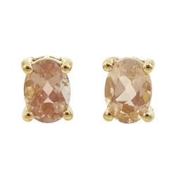 Pair of 9ct gold single stone oval cut morganite stud earrings, stamped