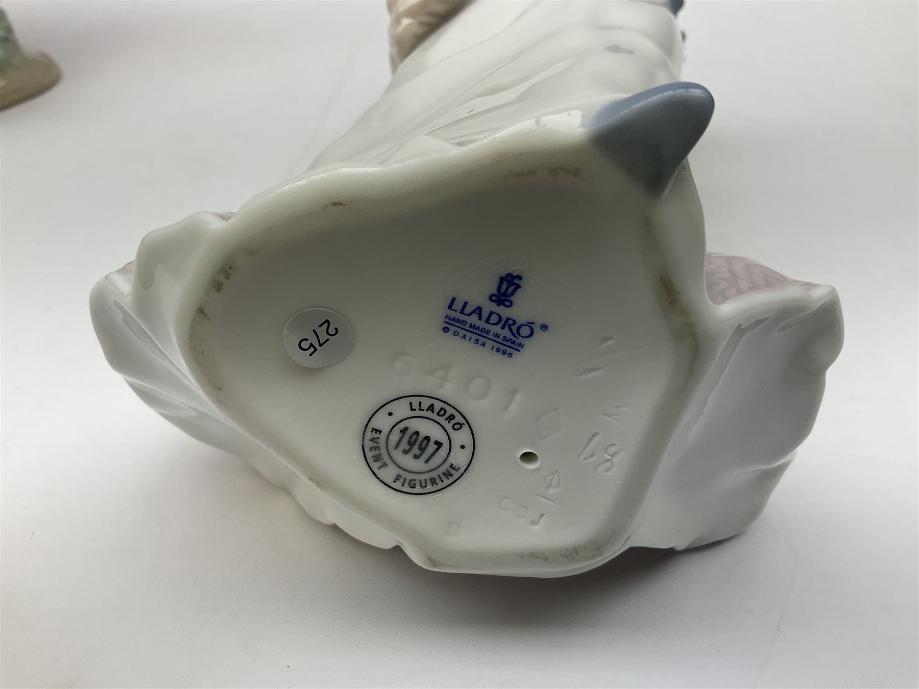 Three Lladro figures, comprising, Dreams of Summer Past no 6401, Spring Breeze no 4936 and Breezy Afternoon 5682 together with Lladro plaque Art Brings us Together no 7677, all in original boxes, largest example H35cm