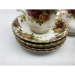 Royal Albert Old Country Roses pattern part tea service, comprising eleven saucers, four teacups,
pair of cake plates, six side plates, six dessert plates, two jugs and teapot