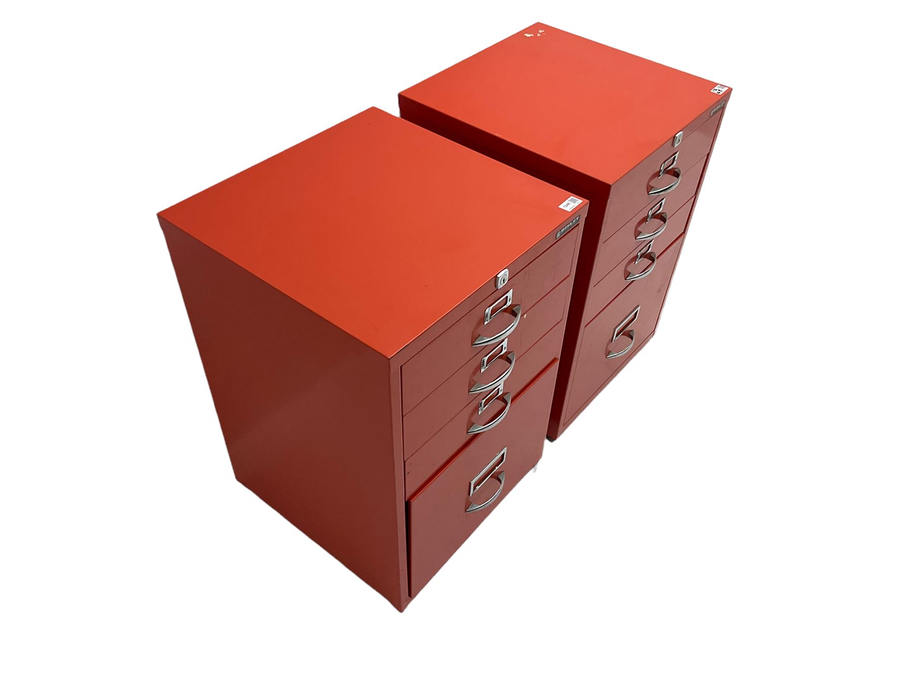 Two red finish 'Bisley' four drawer filing cabinet
