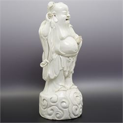 Chinese blanc de chine figure of Shou Lao, standing upon a cloud, H36cm 