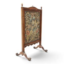 Georgian carved mahogany firescreen, the extending panel with Georgian needlepoint tapestry to one side and Arts & Crafts style machine tapestry to the opposing, on splayed supports with scroll feet