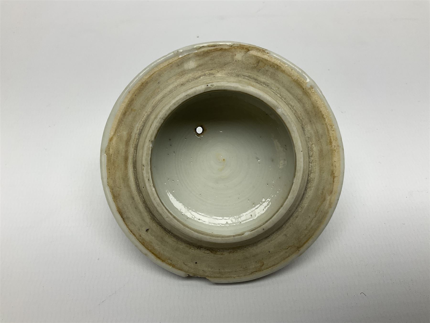 Two late 18th/early 19th century Chinese export teapots, the largest example of globular form with curved handle and straight spout, decorated in the Mandarin style with figural scenes surrounded by red scale reserves, H13.5cm, the second smaller example decorated in underglaze blue with two musicians in a landscape set with willow tree and fence, H10.5cm

