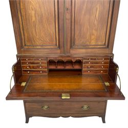 George III mahogany secretaire press, the projecting cornice over two panelled doors with reeded brass door slip enclosing two shelves, the secretaire fall front drawer with leather inset and a combination of small drawers and pigeon holes, three long drawers below, fitted with oval pressed brass plates and handles, shaped apron with splayed bracket feet
This item has been registered for sale under Section 10 of the APHA Ivory Act