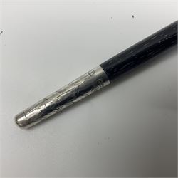 Two early 20th century conductor's ebonised batons each with three silver mounts; one hallmarked London 1915 with presentation plaque 'I.O.R. Presented to Mr. J.R. Maddock 4.1.17' L52cm; the other hallmarked Chester 1908 with vacant cartouche L51.5cm (2)